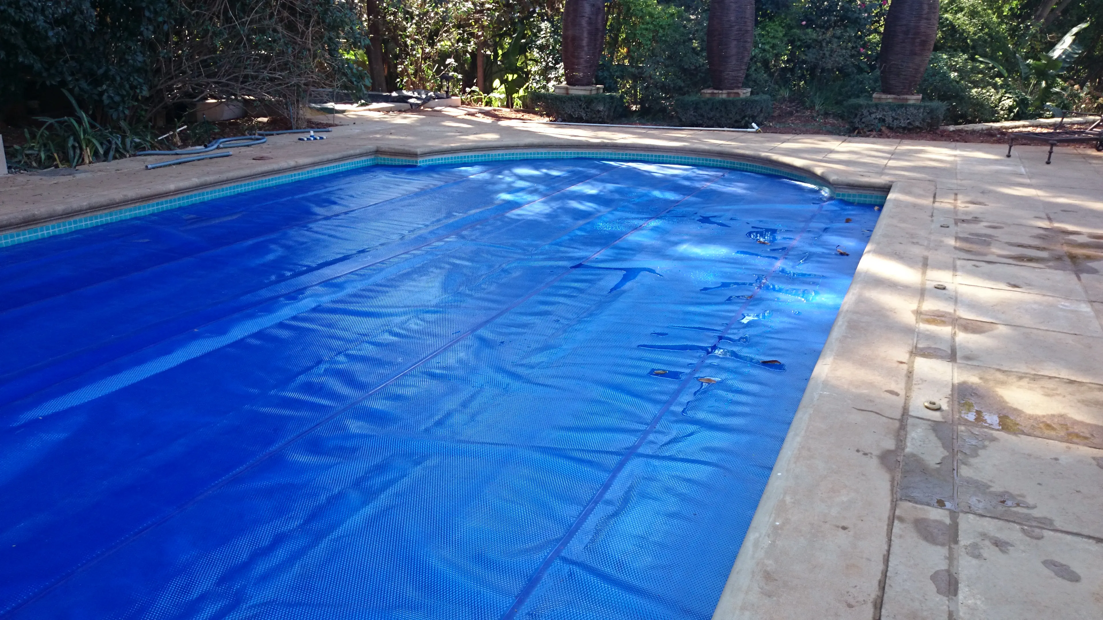 Pool cover roll-up station
