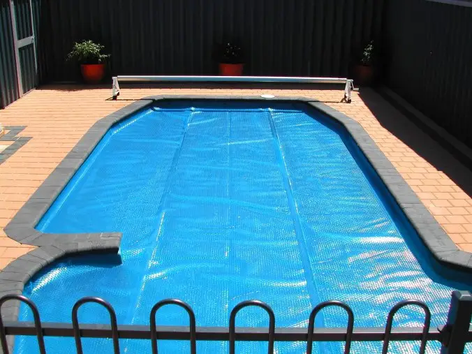 Premium solar pool blanket with roller system